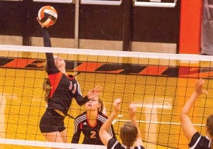 Star Photo/Larry N. Souders Elizabethton freshman Morgan Smith (11) drives the ball cross court for the kill against Lady Rebels from Sullivan South.