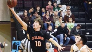 Star Photo/Dave Boyd Elizabethton's Michael Robinson puts up a layup after the steal.