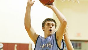 Star Photo/Bryce Phillips  Hampton's Wyatt Lyons pulls up a mid-range shot during Monday's win over Johnson County. Lyons finished the game with a double-double recording 18 points and 15 rebounds.