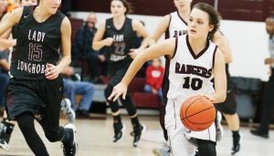 Star Photo/Bryce Phillips  Unaka's Lexi Garland pushes the ball up court during the Lady Rangers' win over Johnson County Tuesday evening.