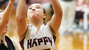 Star Photo/Bryce Phillips Lady Warriors Kaitlin Depriest fights to put up a layup against a Johnson County defender during Monday night's game inside Happy Valley High School.