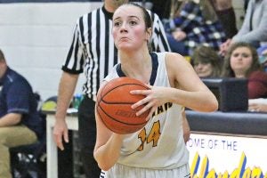 Star Photo/Curtis Carden  Lady Highlander Shian Strickland attempts a 3-pointer in the first half against Avery County. Strickland finished with 16 points on the night.